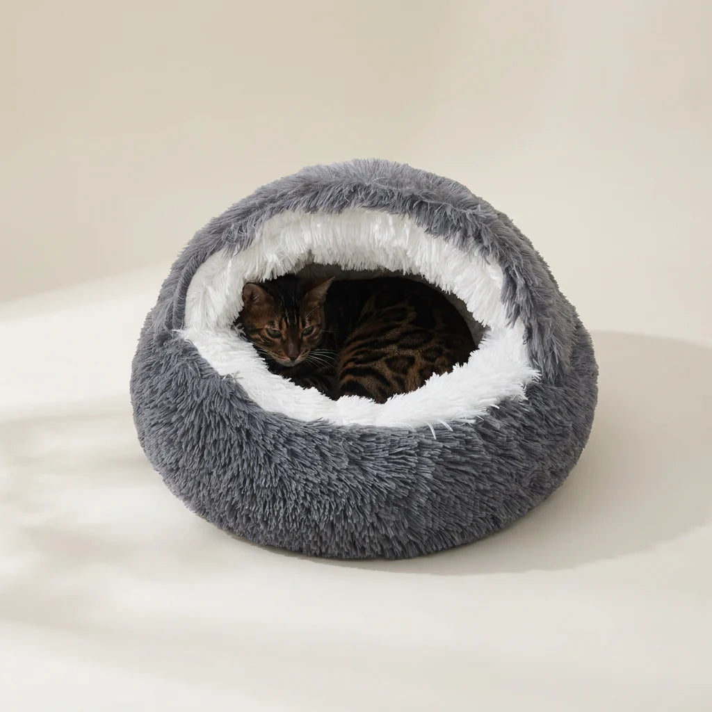 Donut cat bed shown from the side with cushioned walls and waterproof base