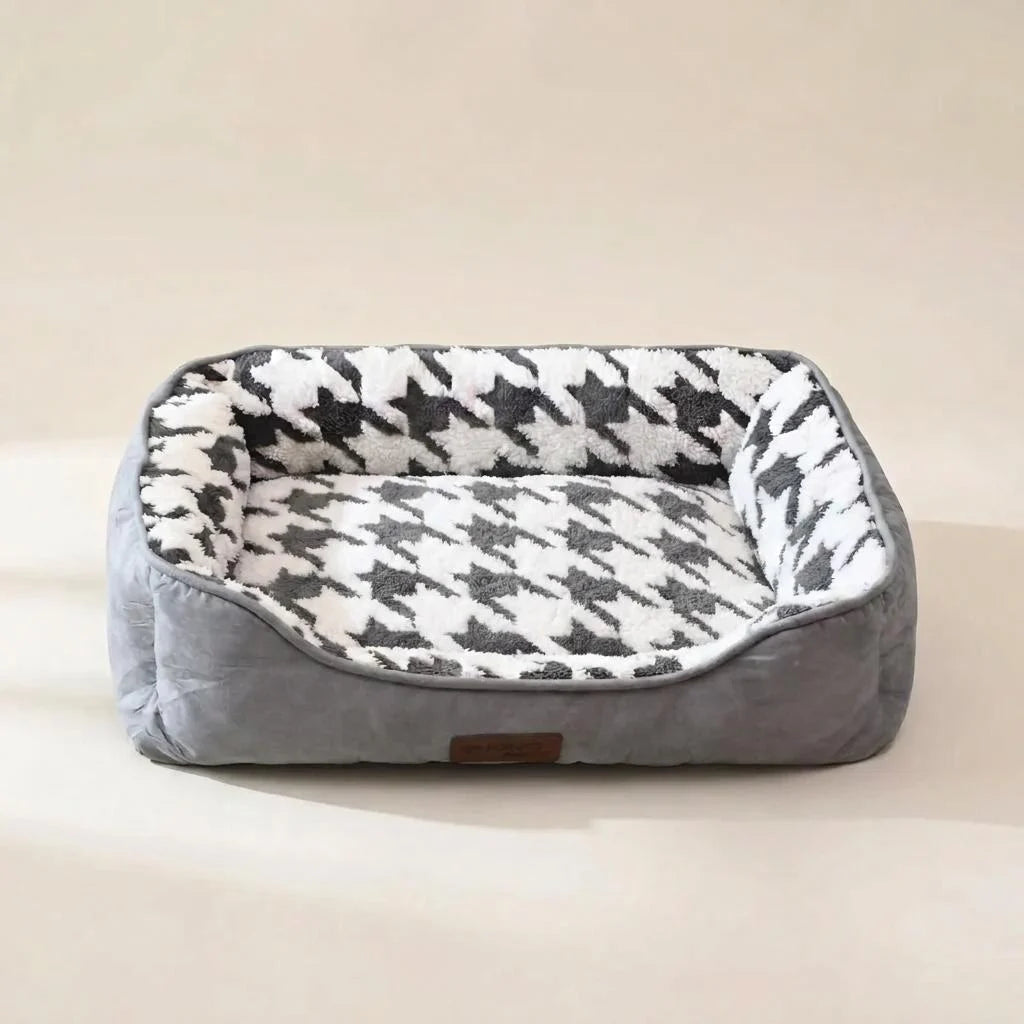 Grey square bolster dog bed with raised sides and a low front edge