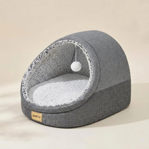 Dark grey covered cat cave bed with hanging play ball at the entrance