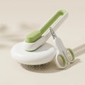 Green self-cleaning slicker brush and matching pet nail clippers on a neutral background