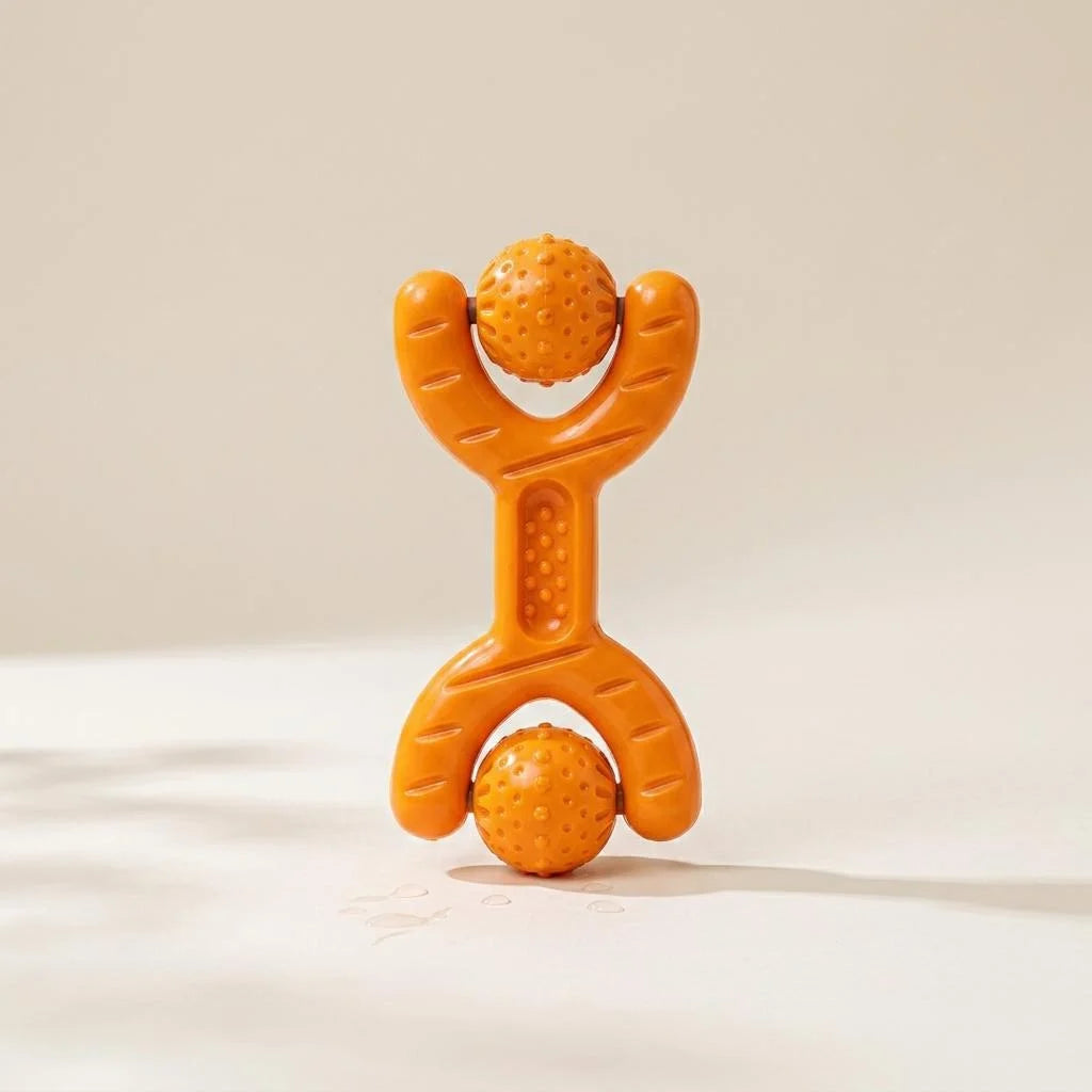 Orange curved chew bone dog toy with spinning balls on each end